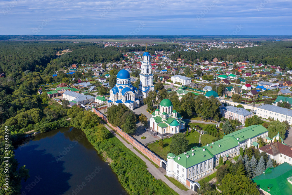 Drone view of Kaluga Monastery Uspenskaya Tikhonova Pustyn on sunny summer day. Leo Tolstoy village, Kaluga Oblast, Russia.