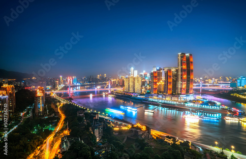 Aerial photography of the night scene of the intersection of the two rivers in Chongqing