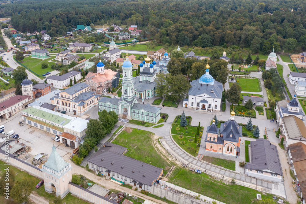 Drone view of Optina Pustyn monastery on cloudy summer day. Kaluga Oblast, Russia.