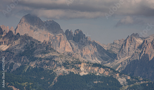 Panoramic views of the entire Catinaccio/Rosengarten mountain massif as seen from Buffaure mountain, above Fassa valley and Pozza di Fassa village, Dolomites, Trentino, Alto Adige, South Tyrol, Italy photo