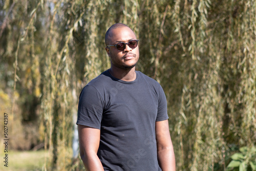African Young Handsome man standing in the park