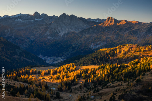 Autumn in the Italian Dolomites. The most beautiful time of the year to visit this place. Beautiful colors and breathtaking views. Mountain peaks above the valleys.