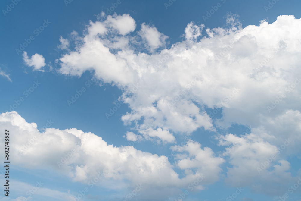 blue cumulus sky with white clouds in daylight