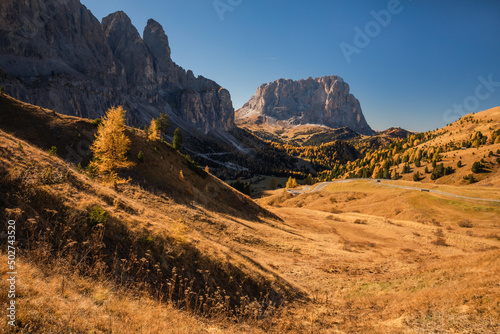 Autumn in the Italian Dolomites. The most beautiful time of the year to visit this place. Beautiful colors and breathtaking views. Mountain peaks above the valleys.