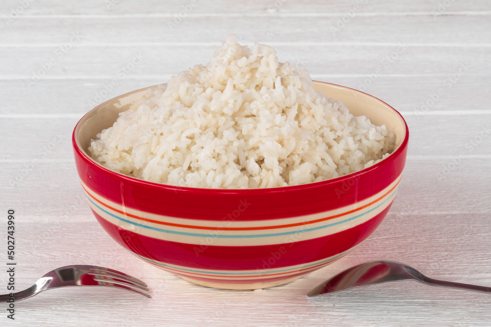 Cooked white rice in red ceramic bowl. Cooked white rice in red ceramic bowl.