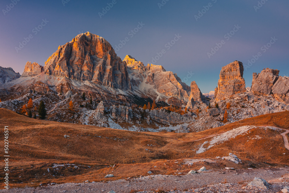 Autumn in the Italian Dolomites. The most beautiful time of the year to visit this place. Beautiful colors and breathtaking views. Mountain peaks above the valleys.