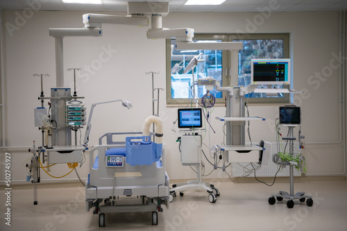 Empty Modern technology in intensive care unit room with different equipment and devices  beds and pillows.