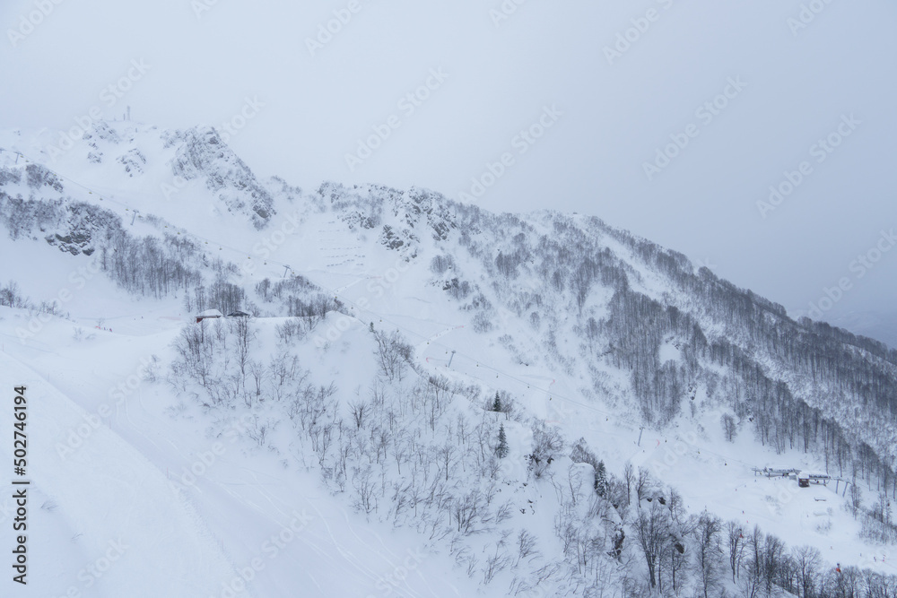 Winter mountain landscape: The Rosa Khutor Alpine Resort near Krasnaya Polyana panoramic background.