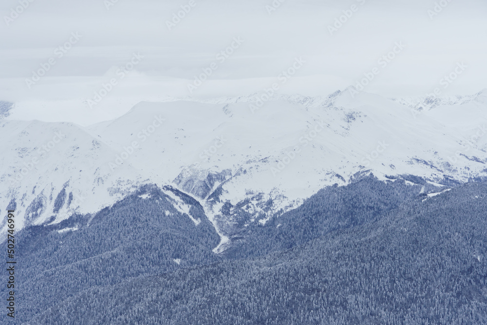 Winter mountain landscape: The Rosa Khutor Alpine Resort near Krasnaya Polyana panoramic background.