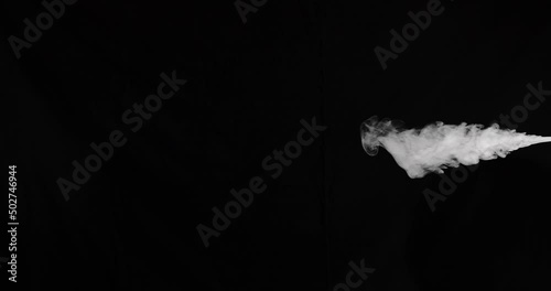 Slow motion stream of smoke from right side of frame that moves towards the center. Shot on black for easy compositing in either vertical or horizontal orientation.