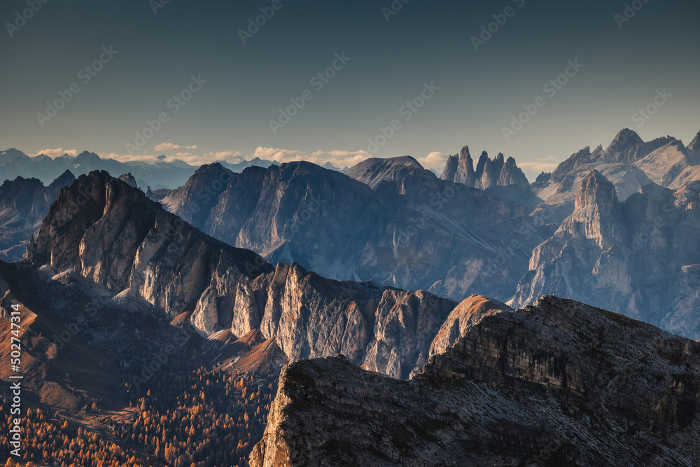 Autumn in the Italian Dolomites. The most beautiful time of the year to visit this place. Beautiful colors and breathtaking views. Mountain peaks above the valleys.