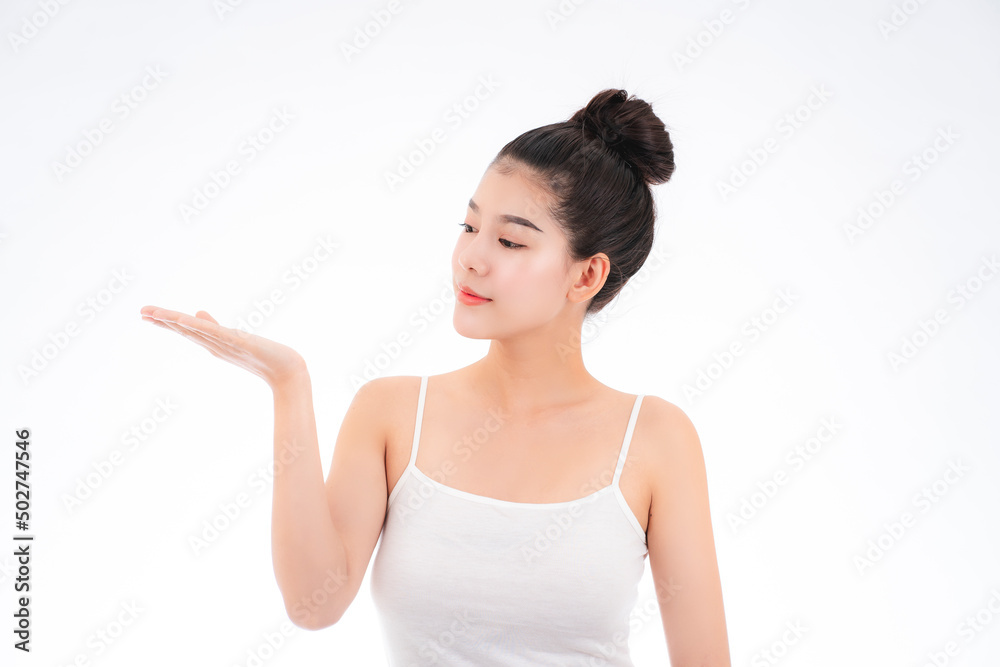 Portrait of attractive asian young woman with beauty skin and face isolated on white background. Healthy skin and face care concept. Portrait of attractive asian young woman with beauty skin and face isolated on white background. Healthy skin and face care concept.