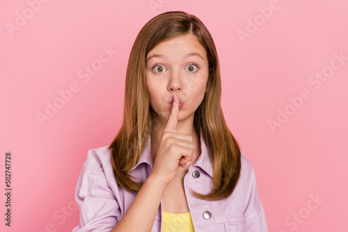 Photo of young girl cover lips finger confidential conspiracy rumor isolated over pink color background