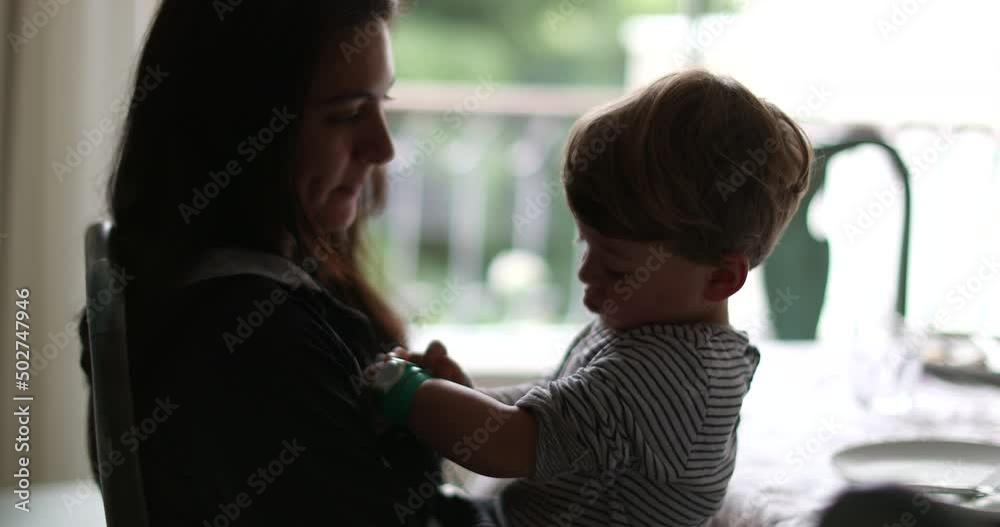 Candid mother and child together silhouette mom and kid togetherness Candid mother and child together silhouette mom and kid togetherness