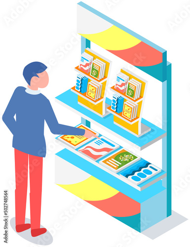 Man looking at stand with books, brochures. Advertising company, promotion, distribution concept. Male choosing product catalogs, magazines. Man near journal, literature exhibition on rack
