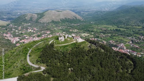 Ancient Norman Castle with the Sanctuary of Maria SS. della Misericordia, located on the chain of the Tifatini Mountains, southern Italy. Castel Morrone, Italy, May 04, 2022. photo