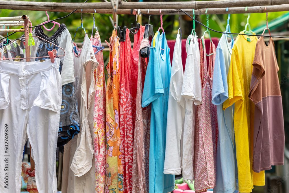 The washed clothes are placed in the sun to dry.
The washed clothes are placed in the sun to dry.