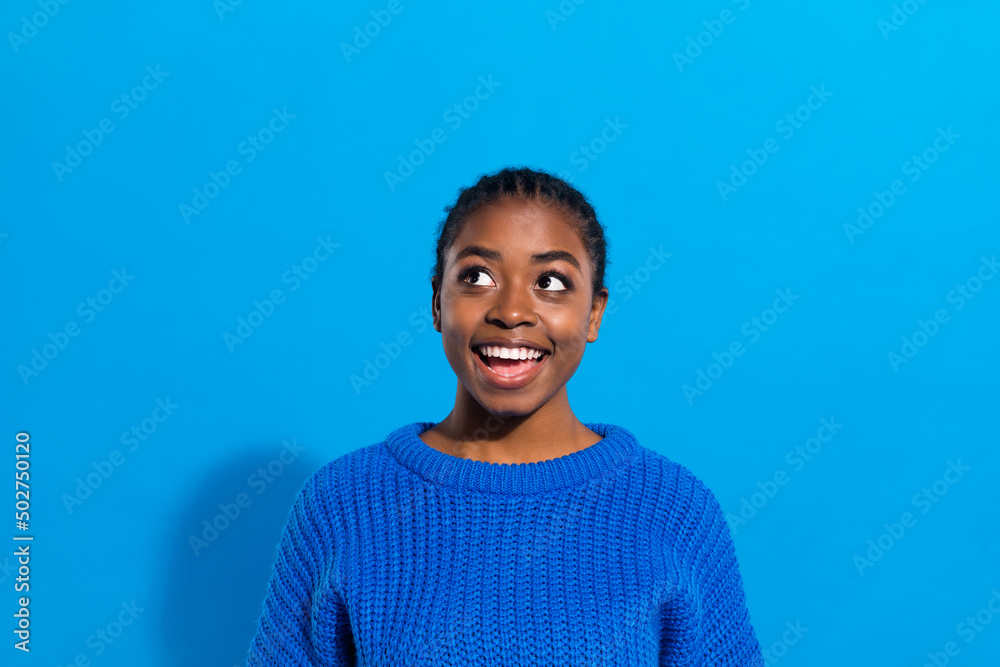 Portrait of attractive cheerful brunette bewildered girl fantasizing copy space isolated over vibrant blue color background Portrait of attractive cheerful brunette bewildered girl fantasizing copy space isolated over vibrant blue color background
