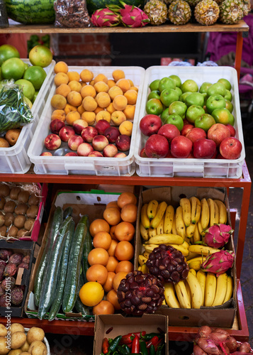 A close up of colourful fruit and vegetable stall at a local market