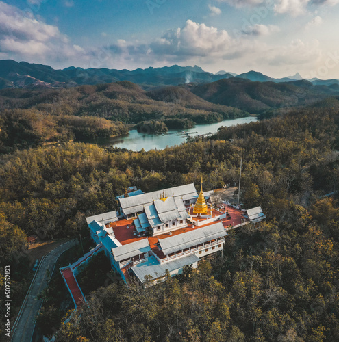 Wat Phrathat Pu Jae buddha and Huai Mae Toek lake in Phrae province, Thailand photo