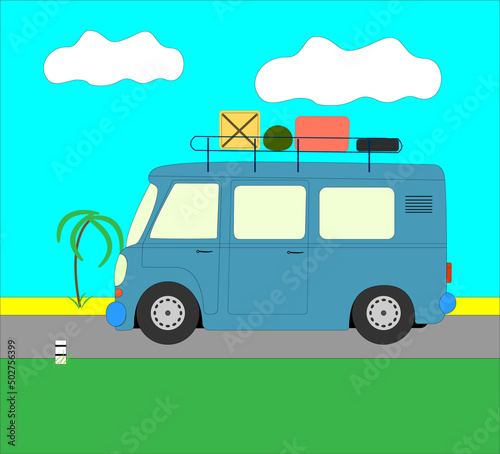 Traveling by car around the world. A small blue bus for travelers is traveling along the road to the sea © Илья Юрукин