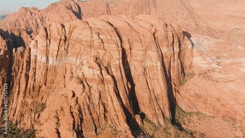 Panning aerial of Utah's desert mountains in the Summer heat. photo