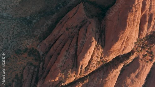 Overhead aerial of the sun setting on rocks in Snow Canyon State Park. photo