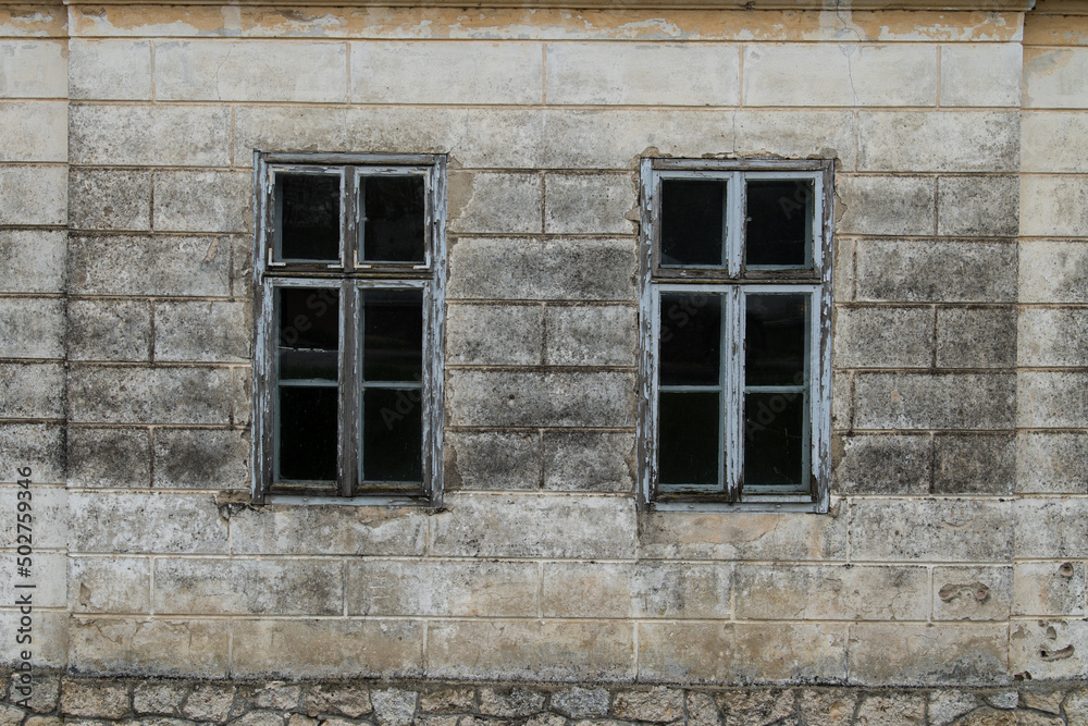 Croatia, May 01,2022 : Rustic style aged window at rural home wall. Croatia, May 01,2022 : Rustic style aged window at rural home wall.