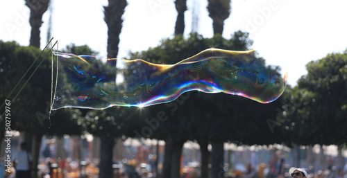 bubble blower on blue sky background photo