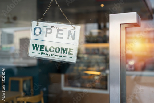 Open on cafe or restaurant hang on door at entrance.