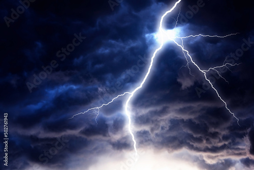 Lightning strike on a dark cloudy sky.