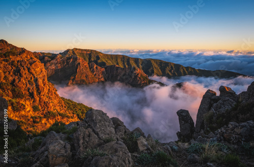 Mountain trail Pico do Arieiro, Madeira Island, Portugal Scenic view of steep and beautiful mountains and clouds during sunrise. October 2021 © Сергій Вовк
