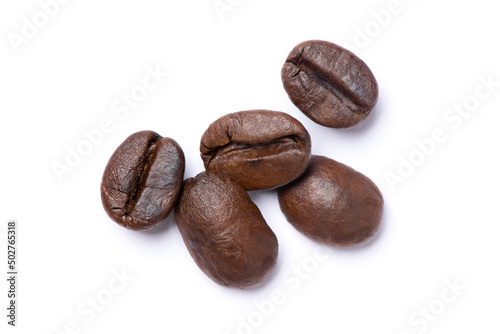 Closeup roasted coffee bean isolated on white background. Top view. Flat lay. Macro.