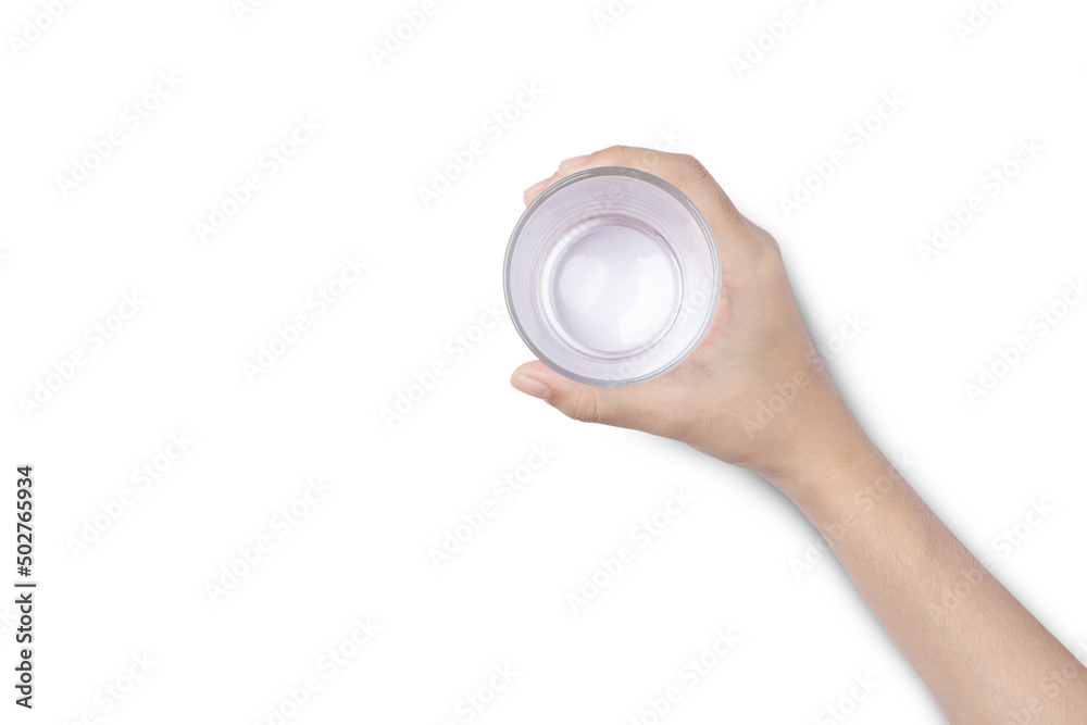 Closeup hand holding drinking glass of water isolated on white background. Top view. Flat lay.