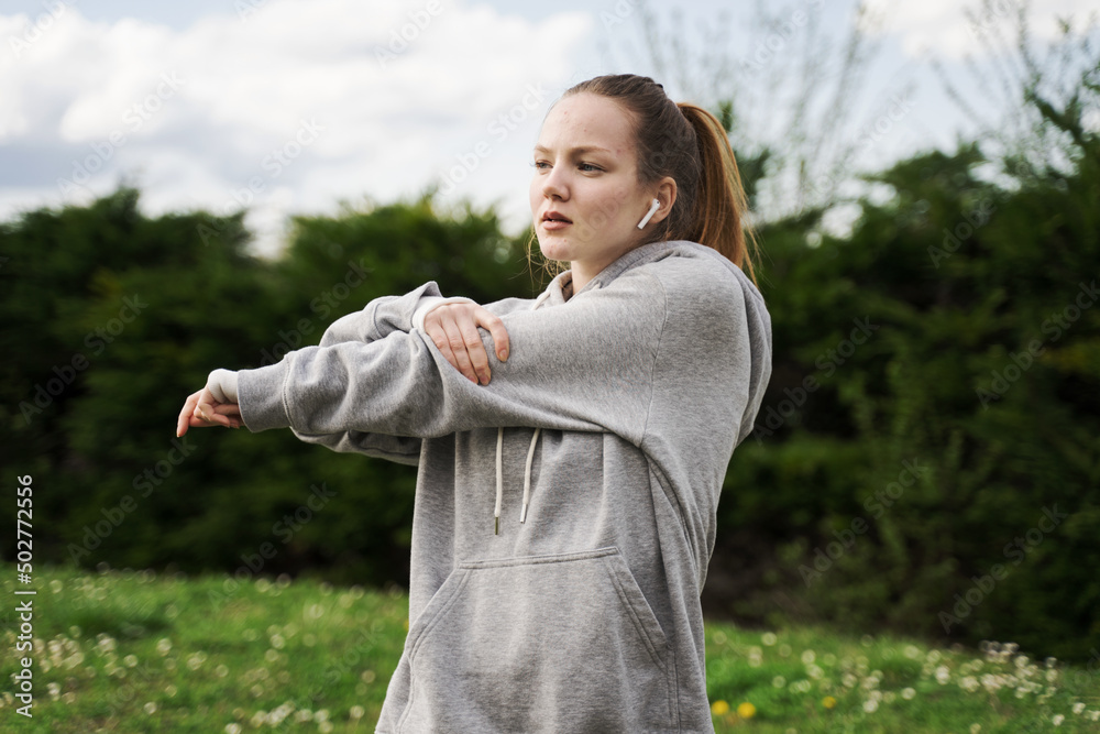 Happy healthy fitness girl doing stretching while doing morning routine exercise Happy healthy fitness girl doing stretching while doing morning routine exercise