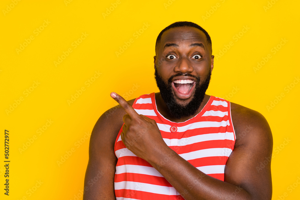 Portrait amazed crazy guy point empty space choice advise rest relax wear red swim suit isolated shine color background