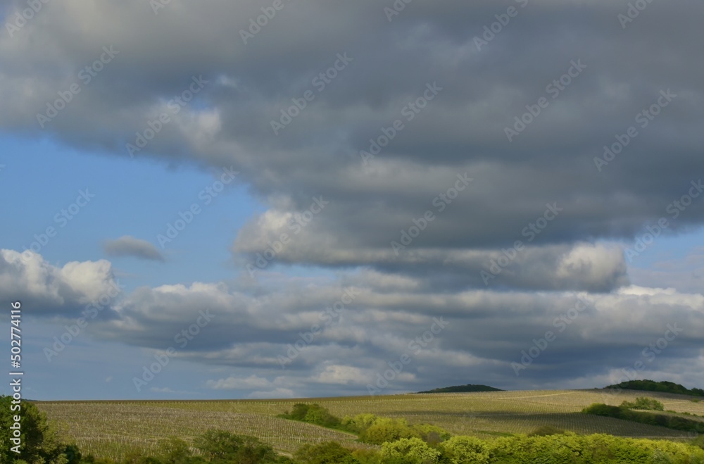 Dense clouds rise above the hills covered with greenery.Sunny day.Spring. Krasnodar region .Russia. Dense clouds rise above the hills covered with greenery.Sunny day.Spring. Krasnodar region .Russia.