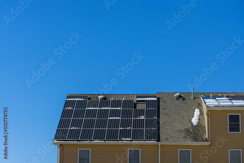 Installing photovoltaic solar panels alternative energy on house roof