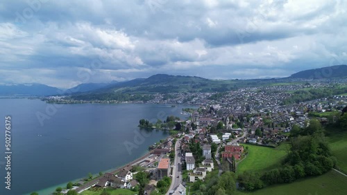 Establish city Richterswil in Switzerland on a cloudy summer day, aerial view