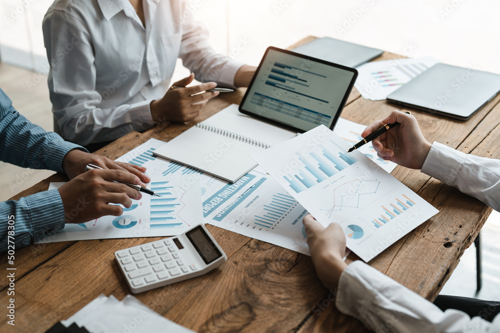 Business people are meeting for analysis data figures to plan business strategies. Business discussing concept Business people are meeting for analysis data figures to plan business strategies. Business discussing concept