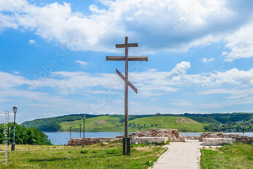 Wooden Orthodox cross on the site of the ruins of the Church of the Annunciation of the Blessed Virgin Mary. The building was destroyed in the 1930s. Shot in Sviyazhsk, Russia