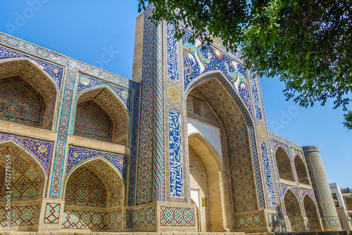 Panorama of Nadir-Divan-Begi Madrasah in Bukhara, Uzbekistan. Mythical Simurgh birds are depicted on the portal of the building photo