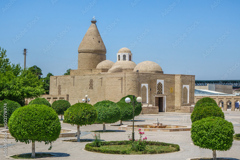 Fototapeta premium Park in front of the mausoleum of Chashma-Ayub. Shot in Bukhara, Uzbekistan
