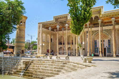 Panorama of Bolo Haouz Mosque with its minaret and the traditional urban pond (so-called howz). Shot in Bukhara, Uzbekistan photo