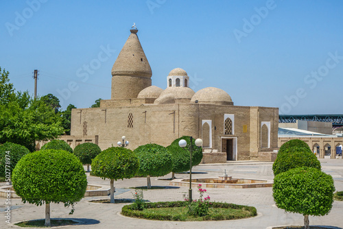 Park in front of the mausoleum of Chashma-Ayub. Shot in Bukhara, Uzbekistan photo