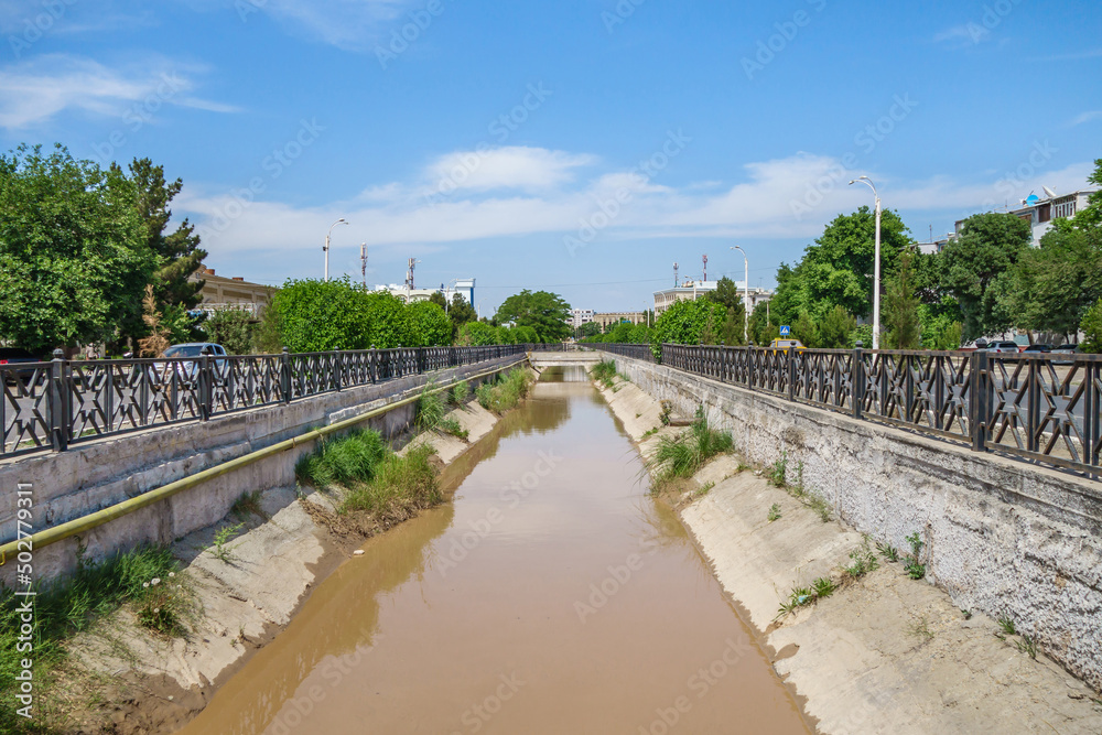 City river canal in Bukhara, Uzbekistan. River that flows is Zerafshan