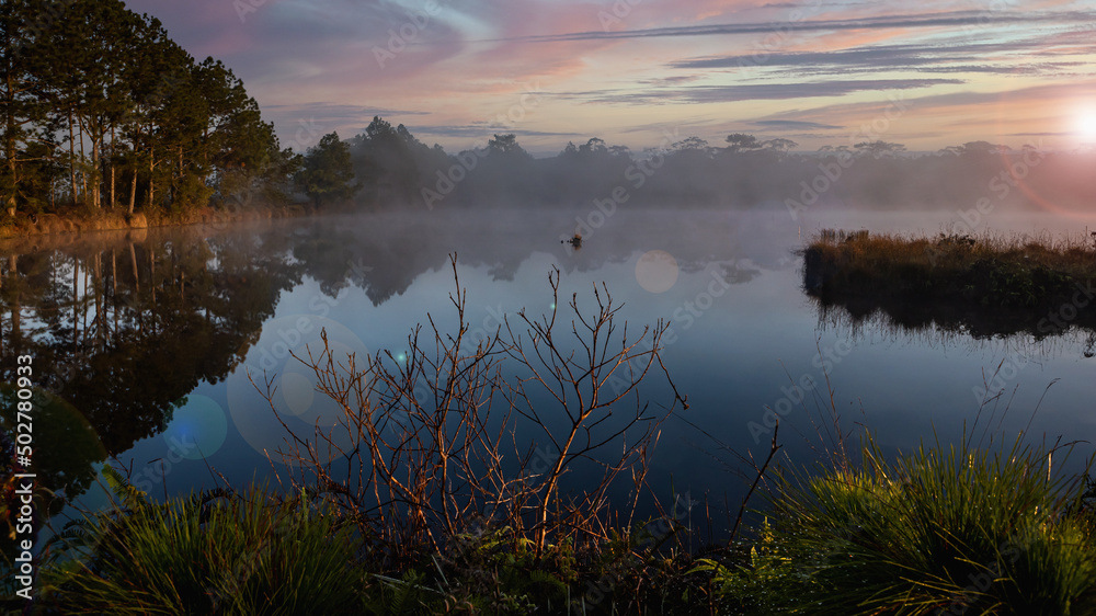Fototapeta premium Sunrise over the river with foggy at Wang Kwang Reservoir Phu Kradueng National Park, Loei, Thailan