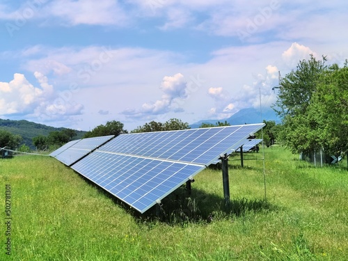 solar panels sky clouds spring season lawn photo