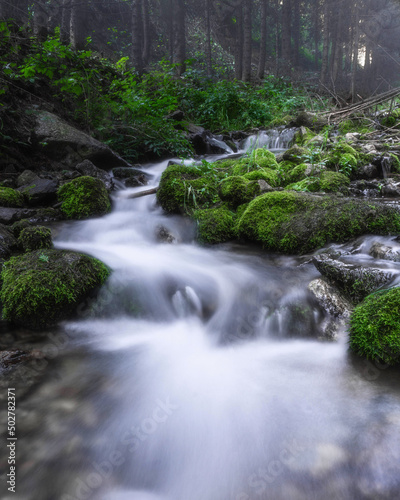Image of flowing foggy mountain river