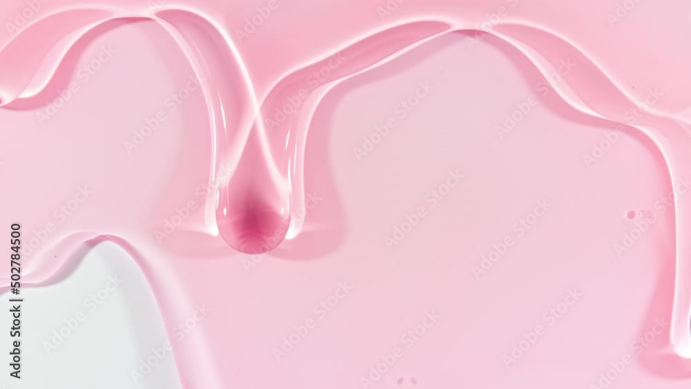 Pink Transparent Cosmetic Gel Fluid With Molecule Bubbles Flowing On The Plain White Surface. Macro Shot of Natural Organic Cosmetics, Medicine. Production Close-up. Slow Motion. High quality 4k Pink Transparent Cosmetic Gel Fluid With Molecule Bubbles Flowing On The Plain White Surface. Macro Shot of Natural Organic Cosmetics, Medicine. Production Close-up. Slow Motion. High quality 4k